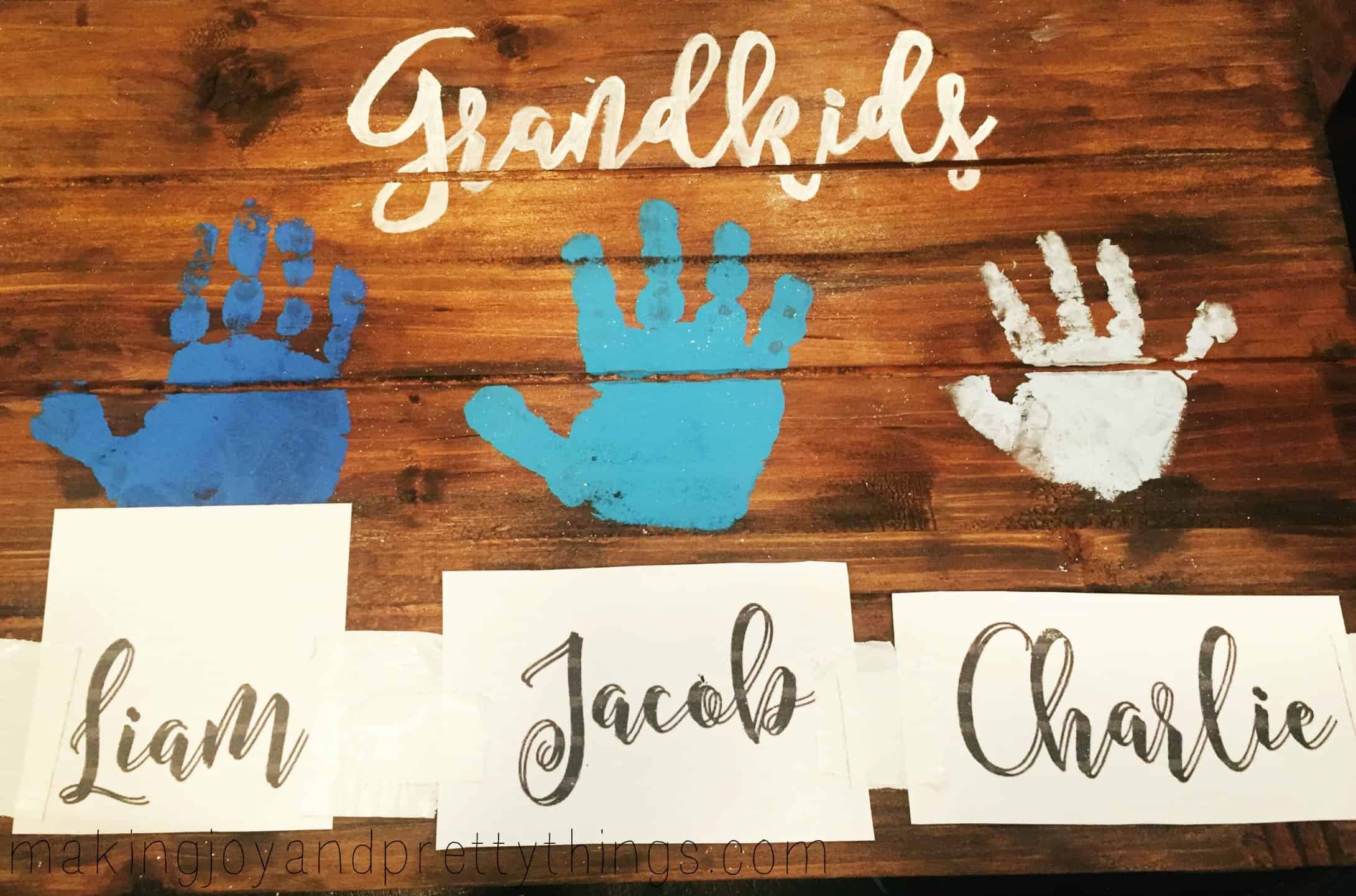 Repeating the chalk and pen trace method to add grandkids names to handprint art for Grandma