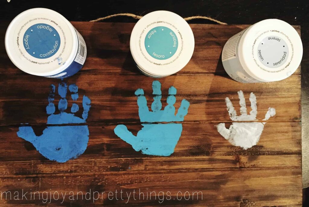 Use chalk paint for adding the handprints on your art for Grandma. This is a great idea to make it personal