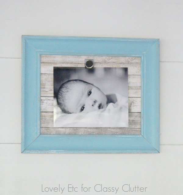 Baby photo in a frame on a shiplap wall as part of the 5 farmhouse diy projects tutorials