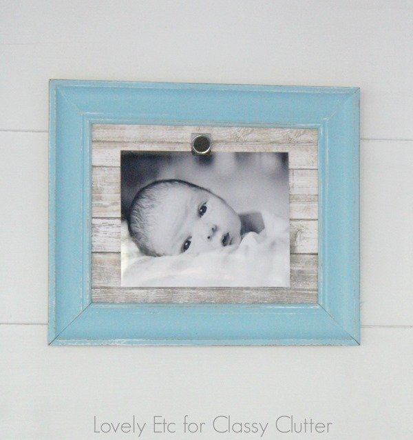 Baby photo in a frame with magnetic backing covered in a contact paper with a rustic shiplap wall look  