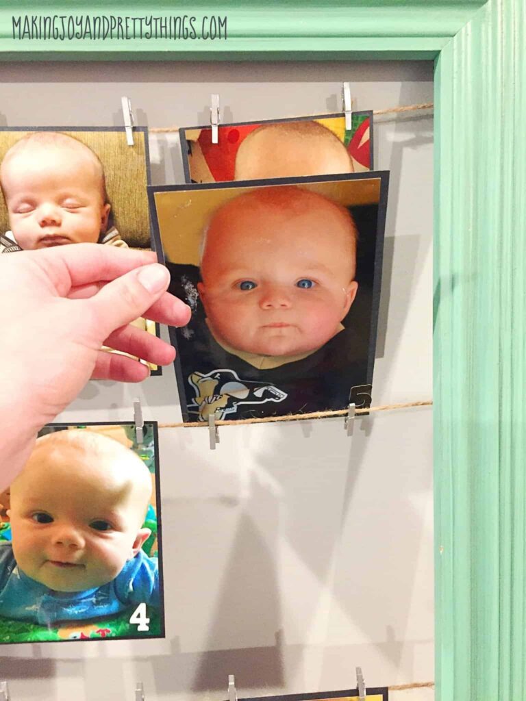 DIY Month by Month picture display. Perfect for 1st birthday parties. Easy DIY craft for birthday party decor!