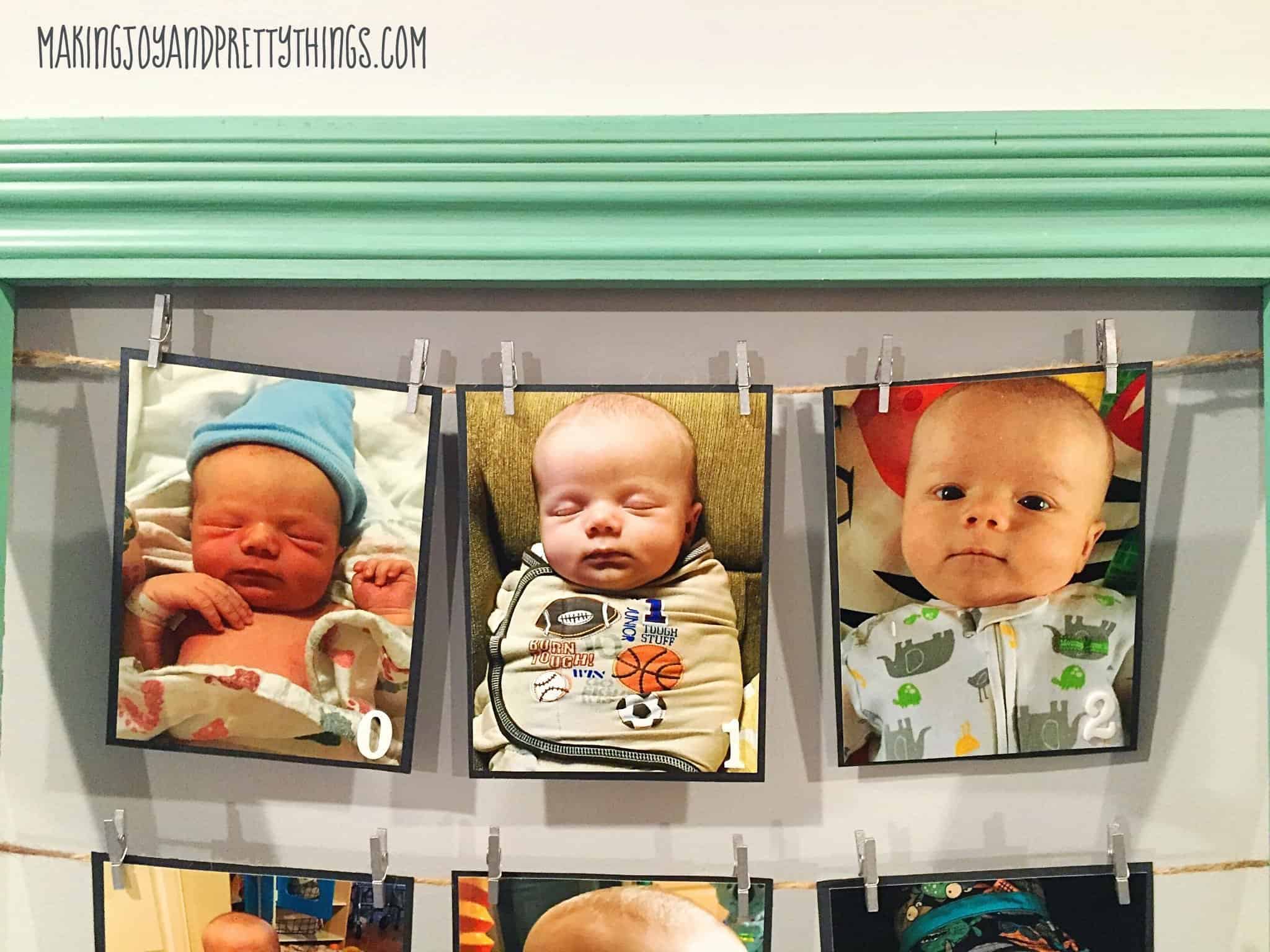 Cute photos of a monthly photo frame display for a 1st birthday hung up with clothes pins on cardstock