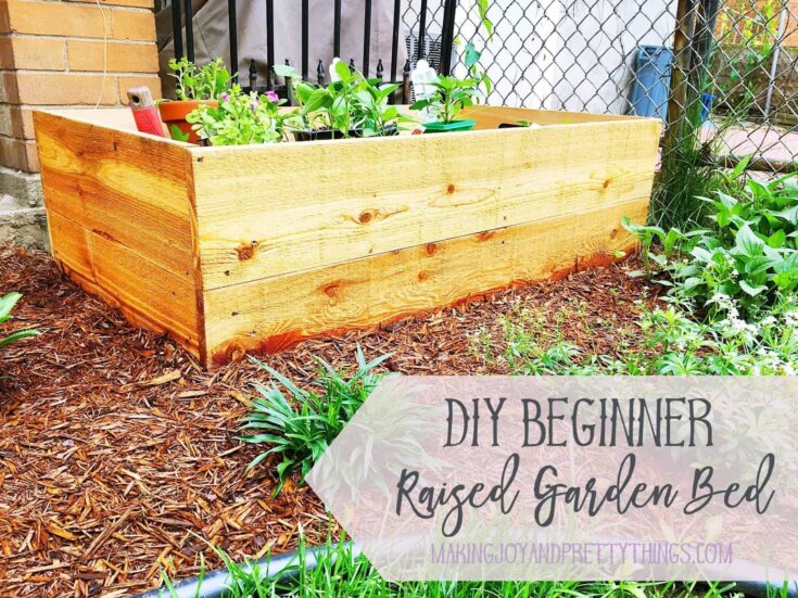 DIY Beginner Raised Garden Bed perfect for small yards and beginner gardeners. Easy DIY that can be done in an afternoon.