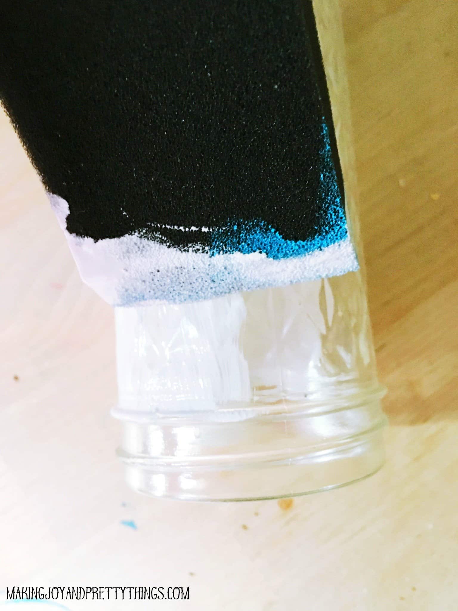 Painting a Jelly Jar white with a foam brush for the thanks for helping me grow free printable 