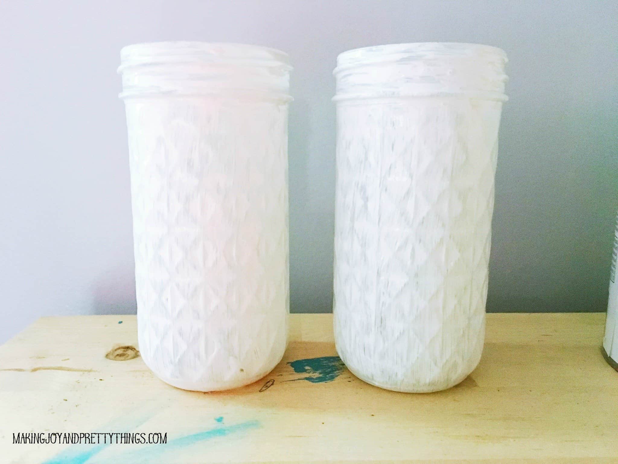 Two white jelly jars ready to be distressed that will have a thank you for helping me grow printable attached