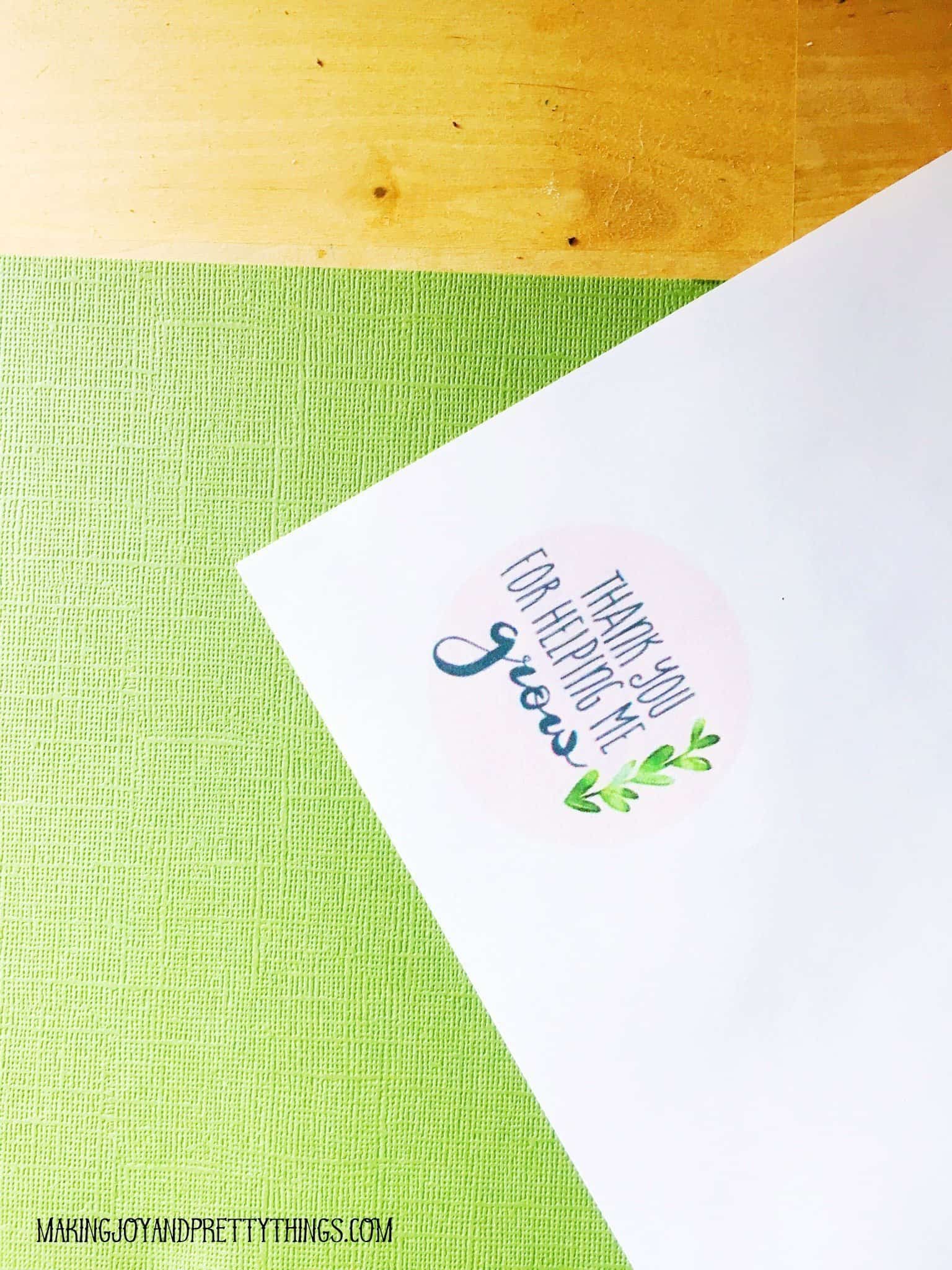 Using cardstock and paper to create a tag with the thank you for helping me grow printable free