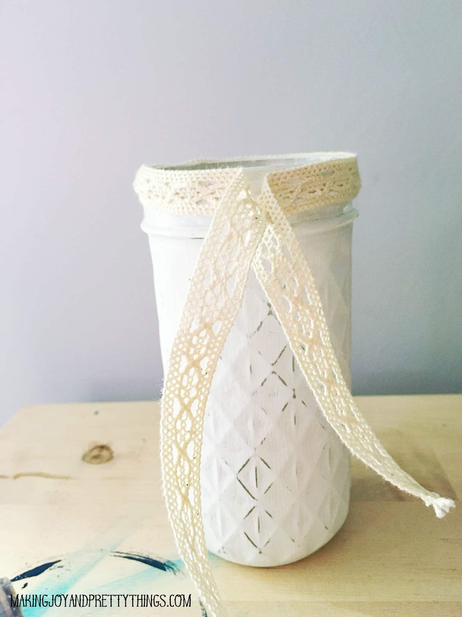 Using ribbon to ad a nice touch to a jerry jar gives off such a beautiful accent to the distressed technique
