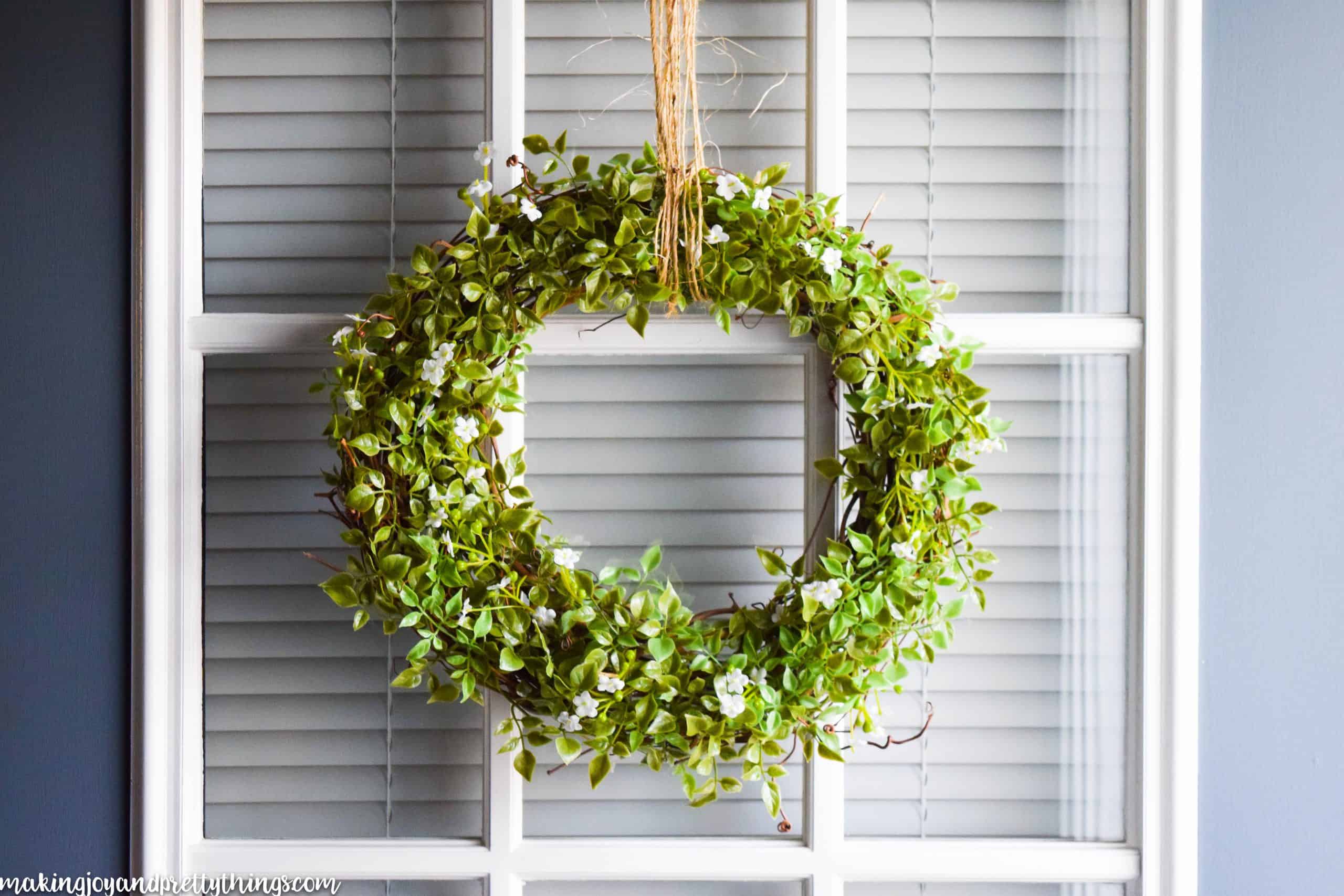 This simple farmhouse wreath is an easy DIY to add fixer upper and farmhouse style to your home. Easy to make and has a beautifully simple finish. Bring the farmhouse style home decor into your home