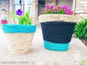 Rope wrapped and painted DIY planters. Perfect easy DIY to kick off summer. Can be customized with any color to compliment your garden area. Makes a great DIY gift.