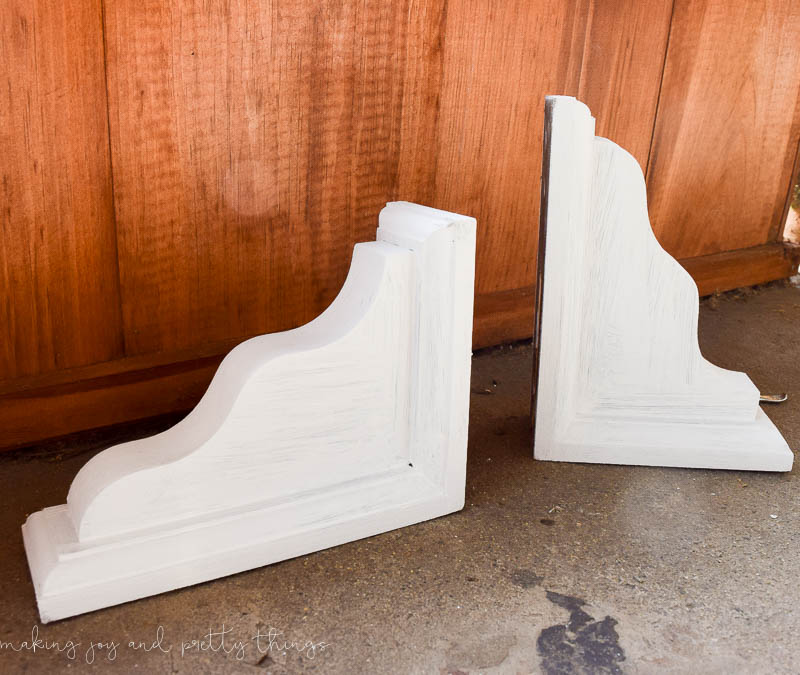 Paint corbels that you stained with a dark stain to complete the first part of distressing new materials to look old