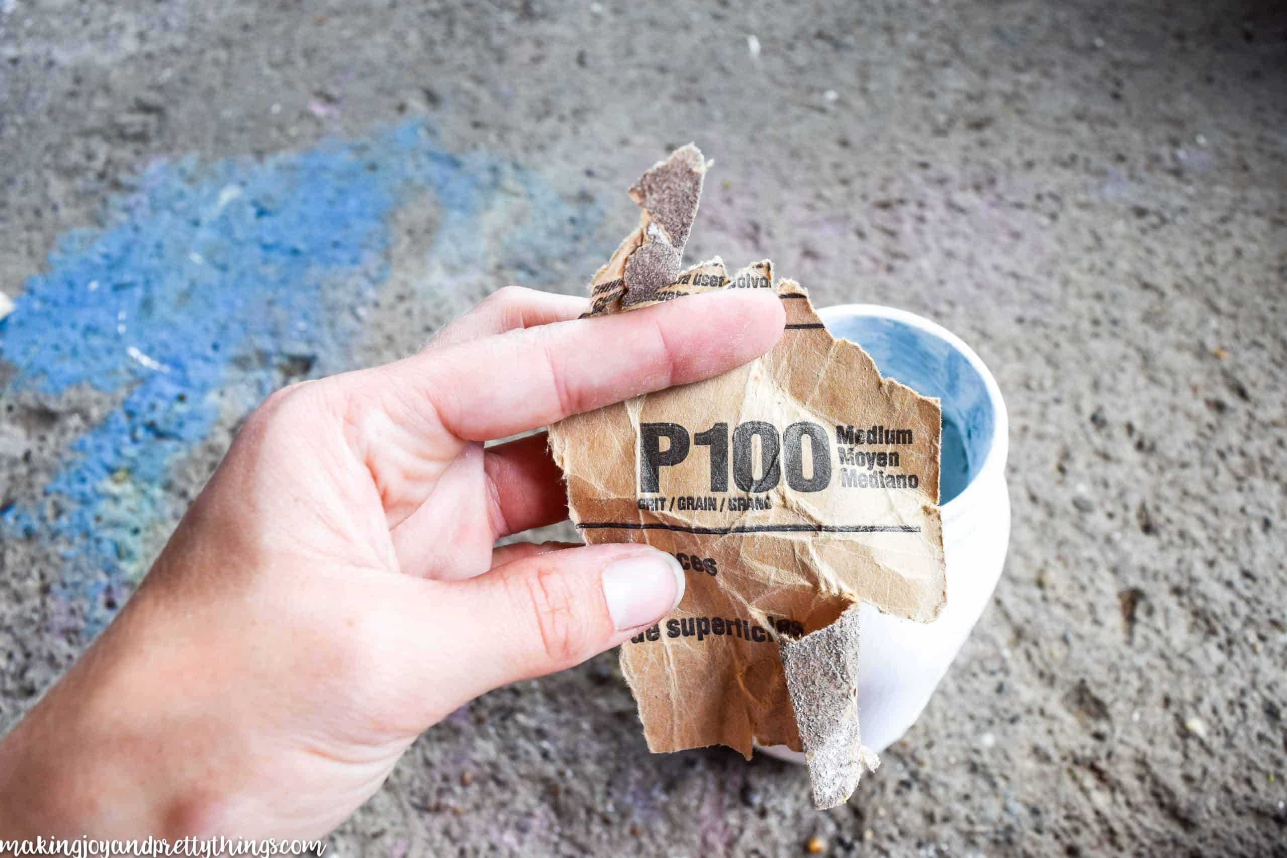 I used some sandpaper I had on hand to distress it a little. Â I focused on the areas that had lettering or markings on the sides to really bring out character.