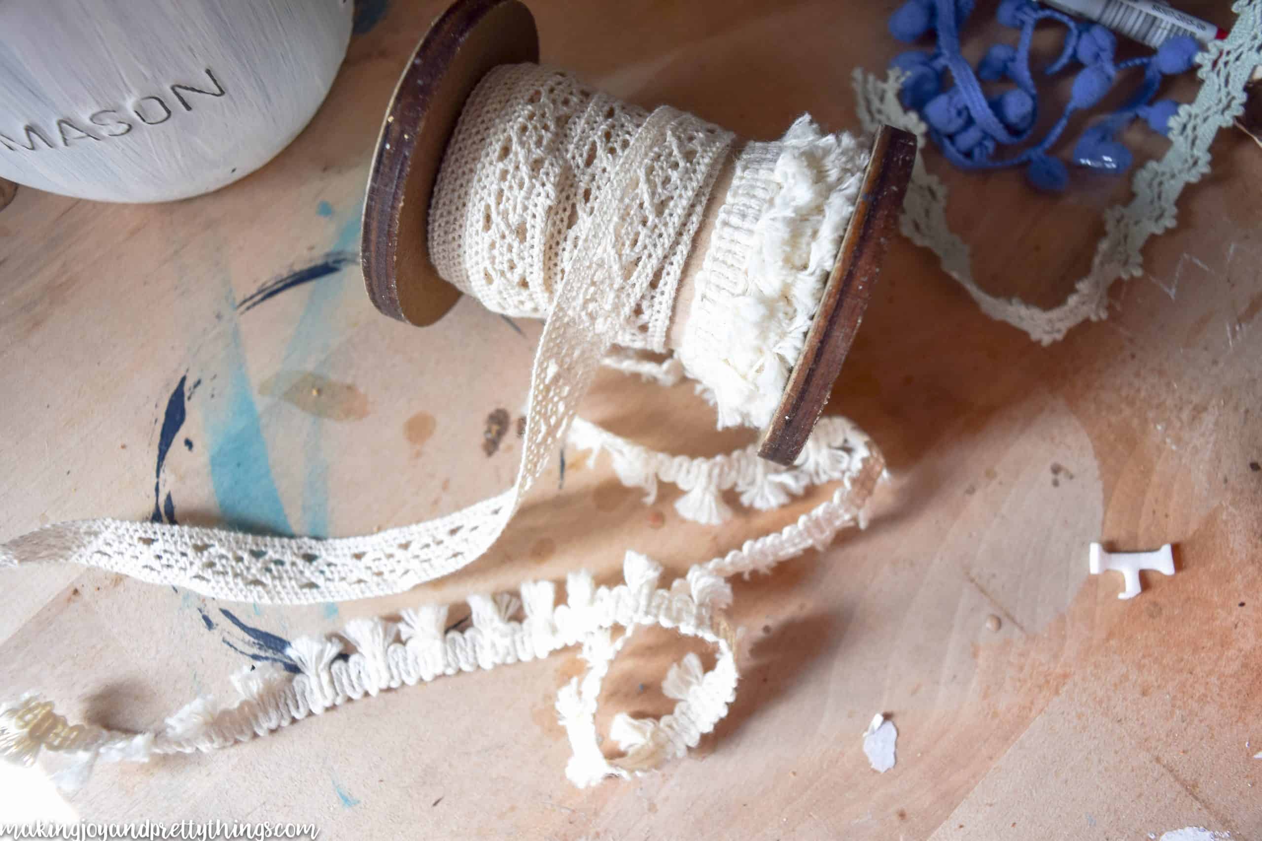 Adding a bit of ivory trim is a great way to add a farmhouse look to a project that is distressed