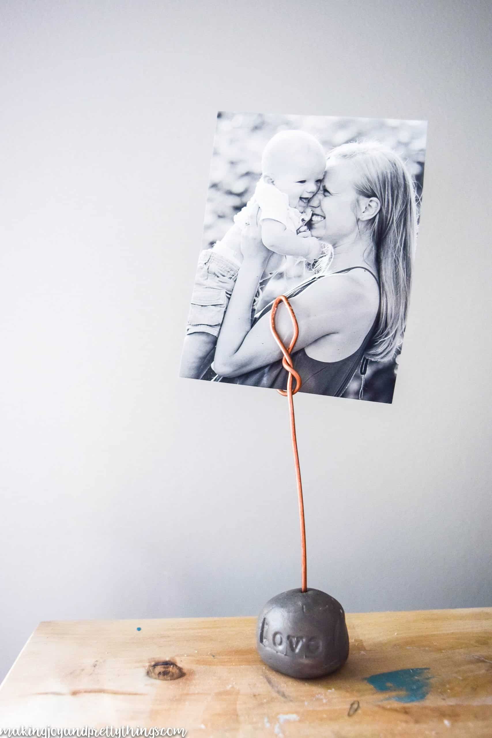a Photo of a mother and child put on a base with copper to hold a picture on a desk top with rustic finishes