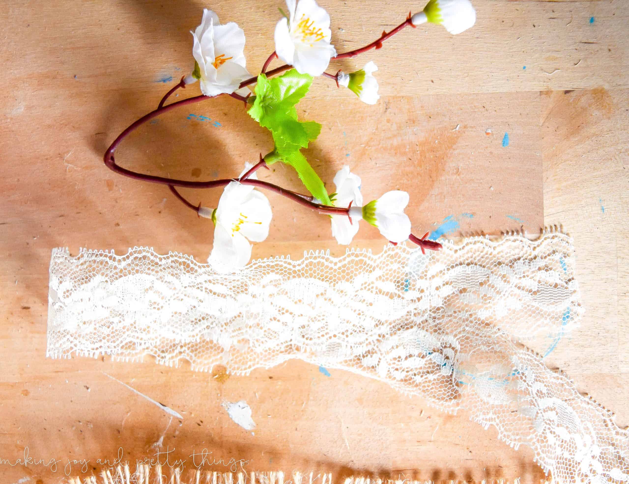 a peach blossom and lace cut to length to be used in a farmhouse DIY for the new season