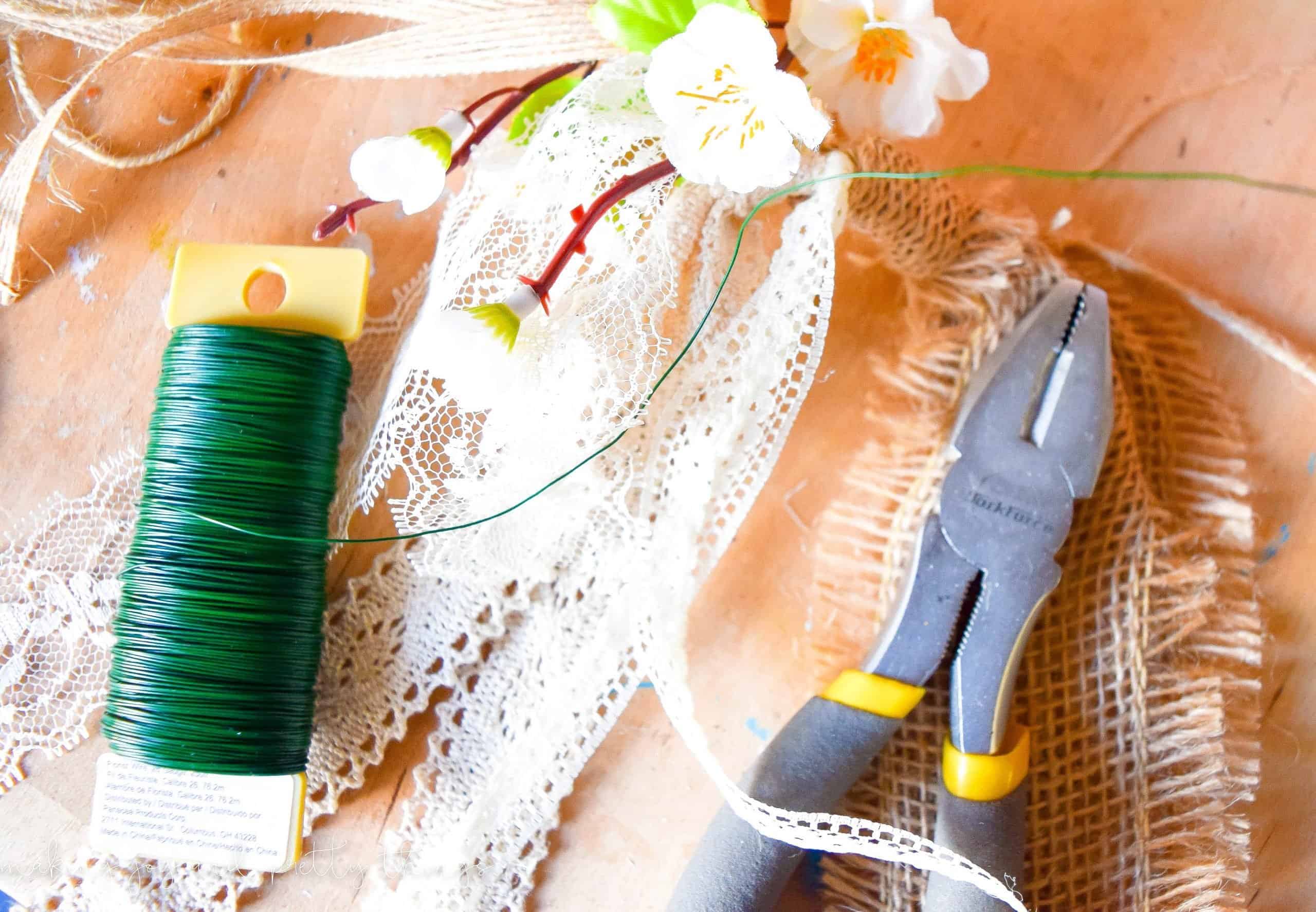 Using floral wire is great way to secure flowers to pretty much everything for this spring mantel garland