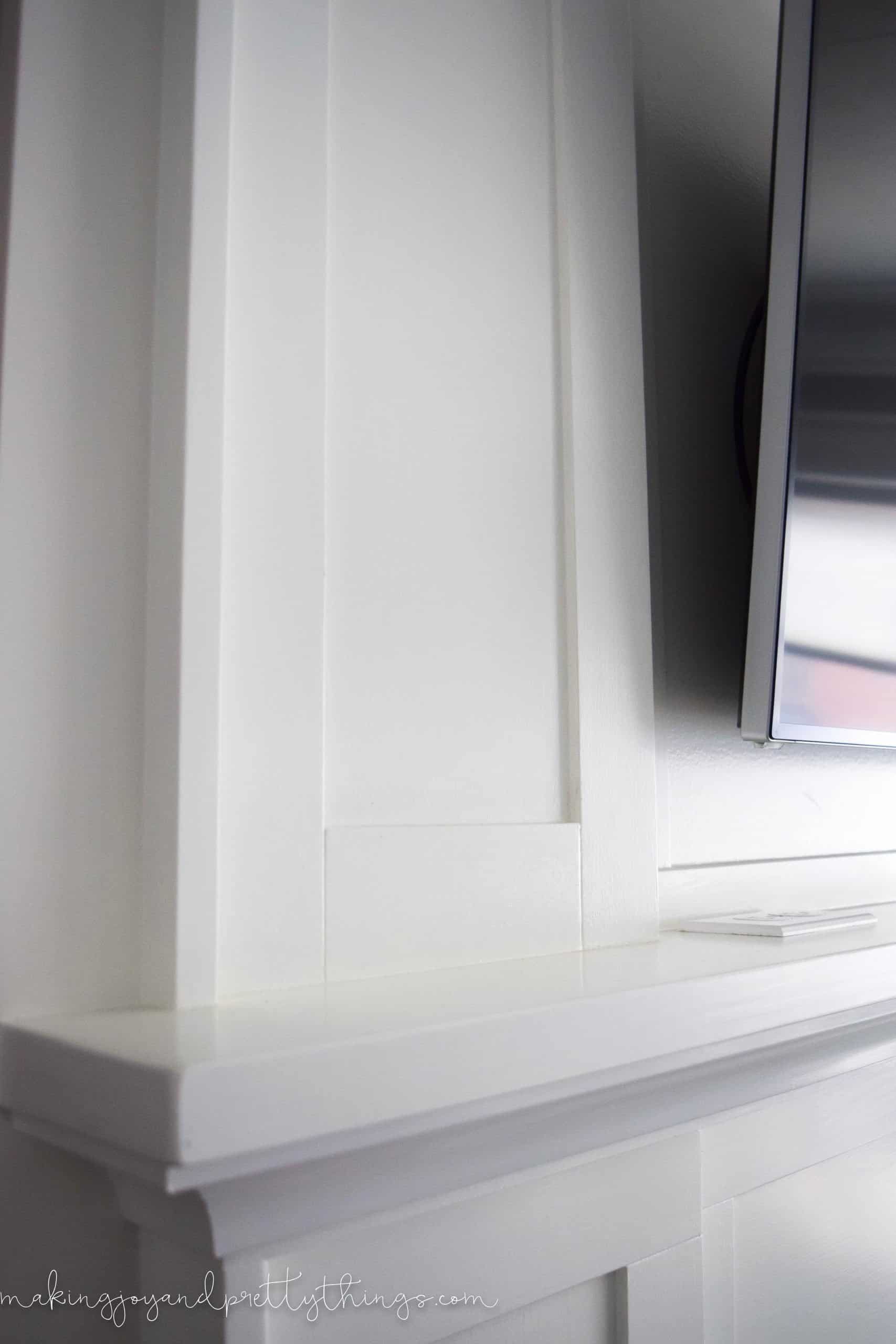 A look at the empty white marble fireplace mantle shelf, where our summer mantle decor will soon live.