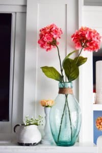 Need some farmhouse inspiration for your mantle? Come check out this amazing and easy DIY farmhouse mantle. Tons of farmhouse inspiration and farmhouse decor with touches of summer color.
