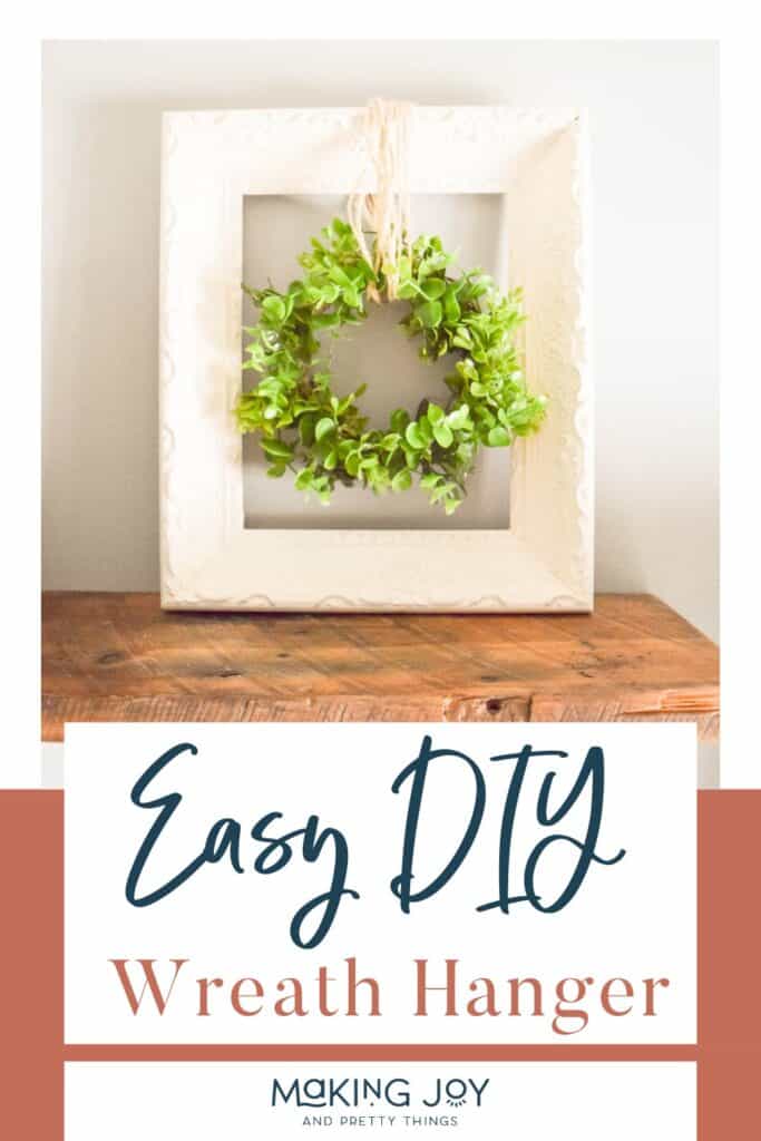 Photo of a wreath hanger with text overlay that reads 'Easy DIY Wreath Hanger.'