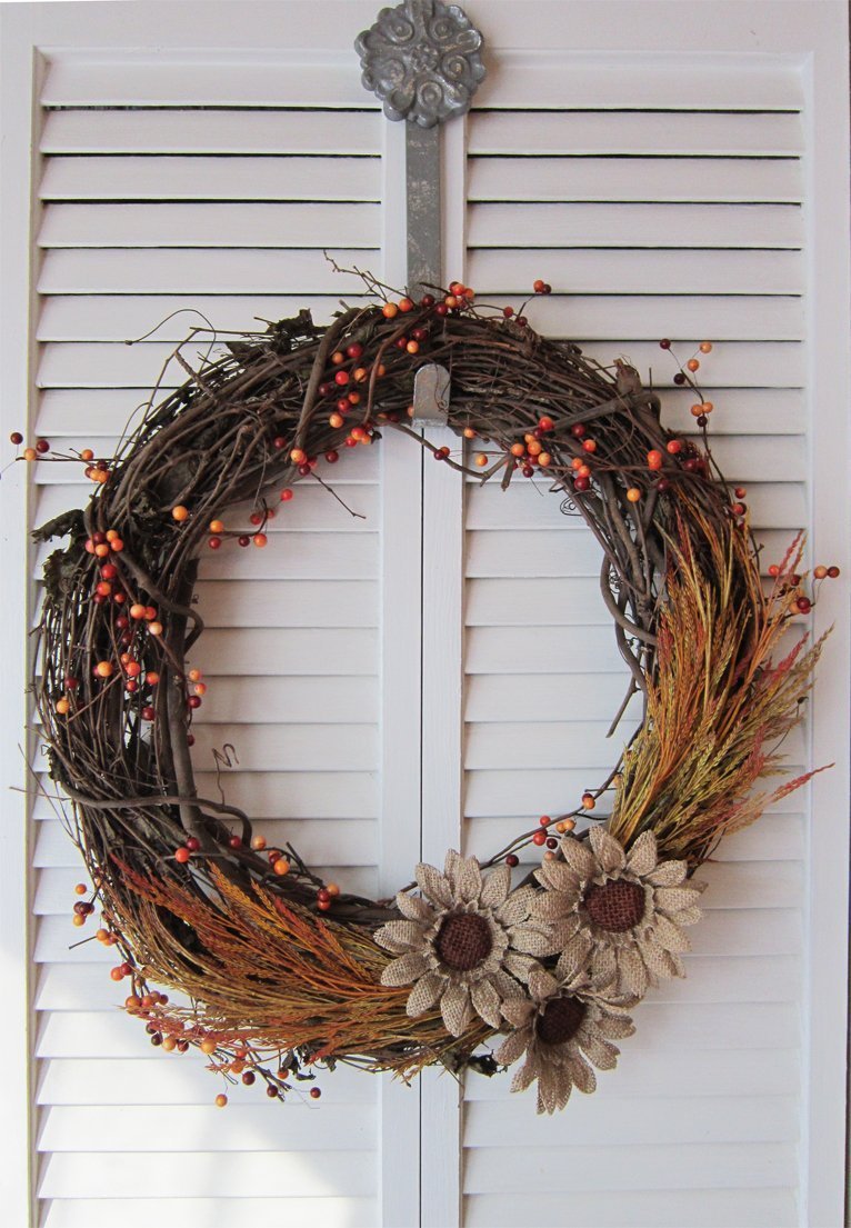 Beautiful DIY fall wreath with burlap flowers and fall grasses wrapped around the entire wreath
