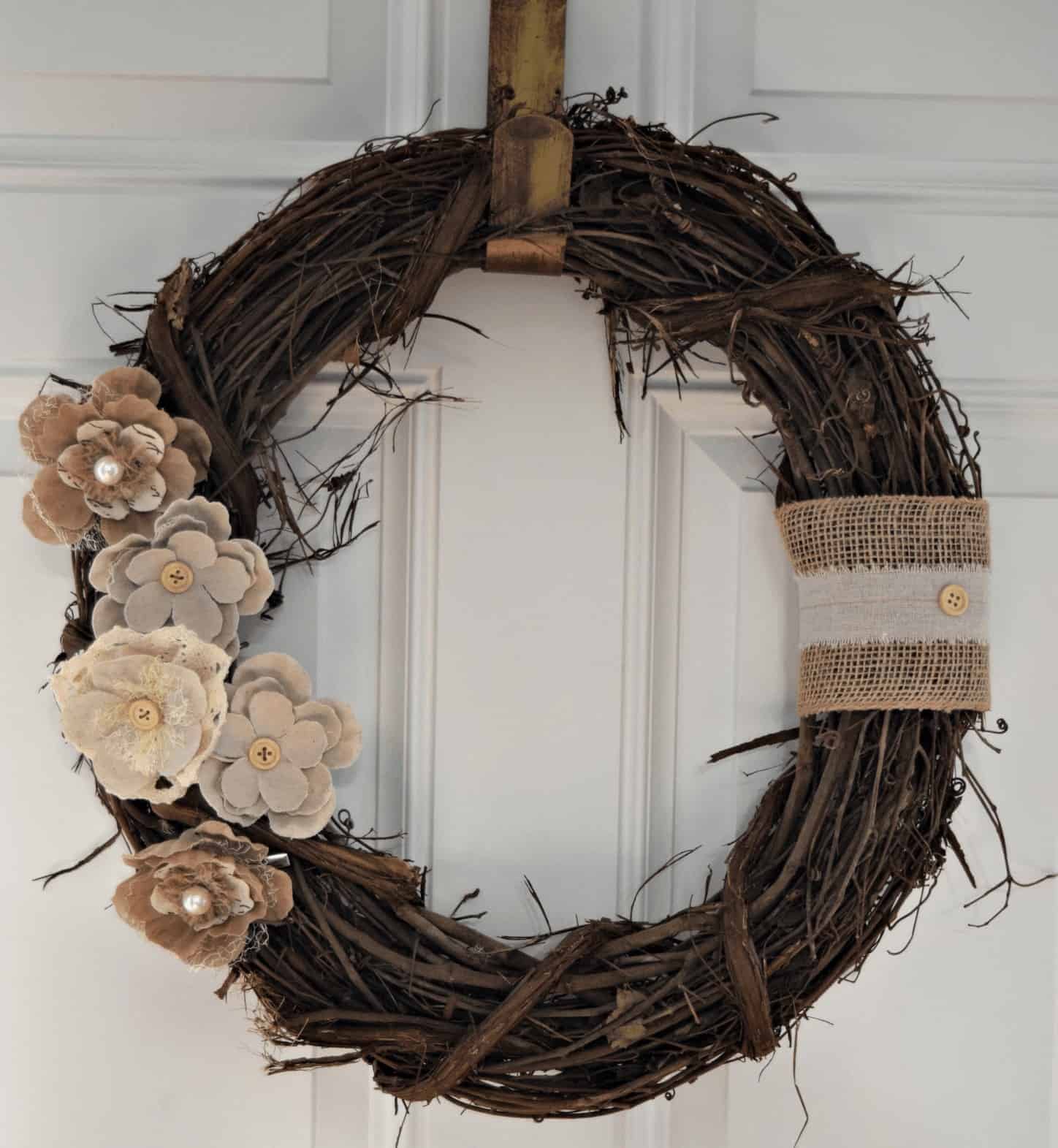 Flowers and burlap in neutral colors are a great way to decorate your front door and are a great visual way to end summer