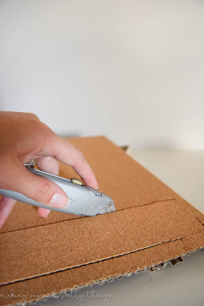 Cutting cork and stacking is a great way to make a push pin feature for a DIY memo board in an office