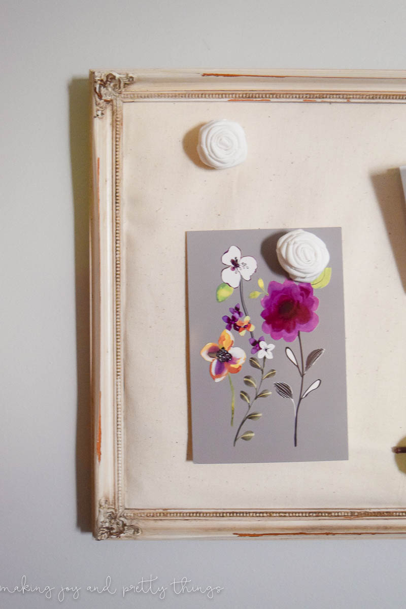 Using the DIY memo board to hang some decorations and a floral picture to help decorate an office space