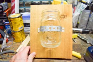 This Rustic Scrap Wood Hanging Mason Jar is a perfect DIY project to get the farmhouse and fixer upper look on a budget!