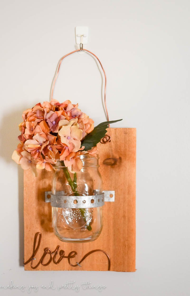 Need a tutorial on a wall hanging for  your house then this mason jars on wood DIY is a simple cheap way to get some easy decor