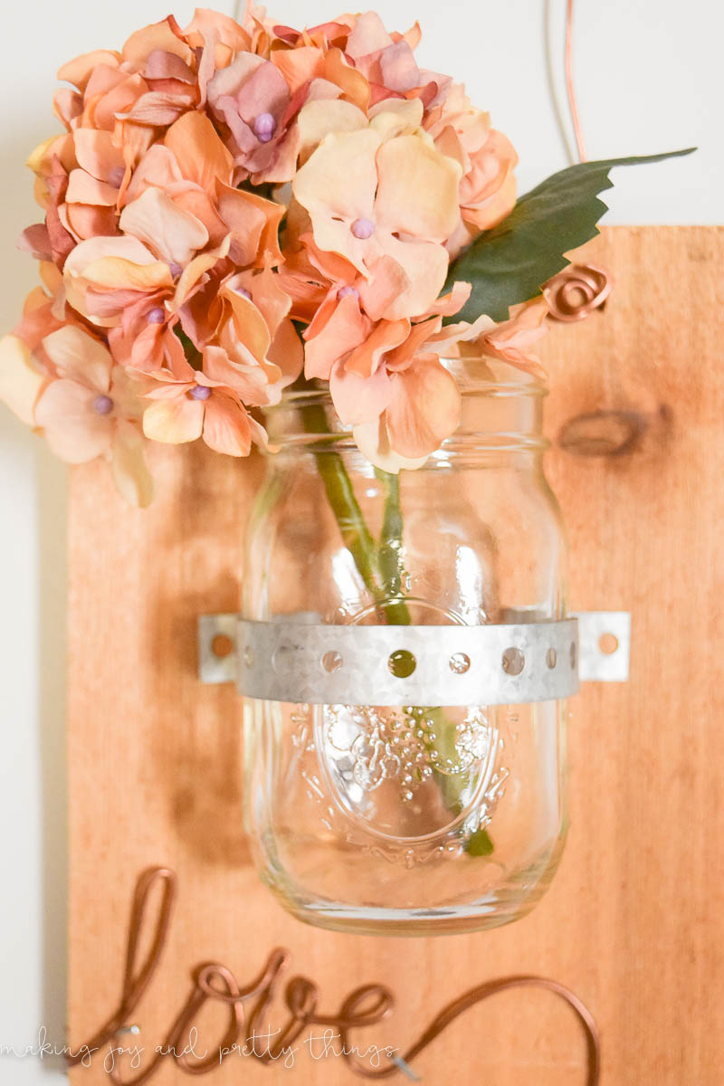This rustic decor item gives an amazing farmhouse feel to an office space and shows a great use with mason jars