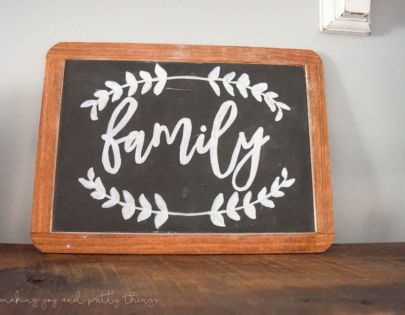 DIY lettered chalkboard sign with frame and cute design with white lettering
