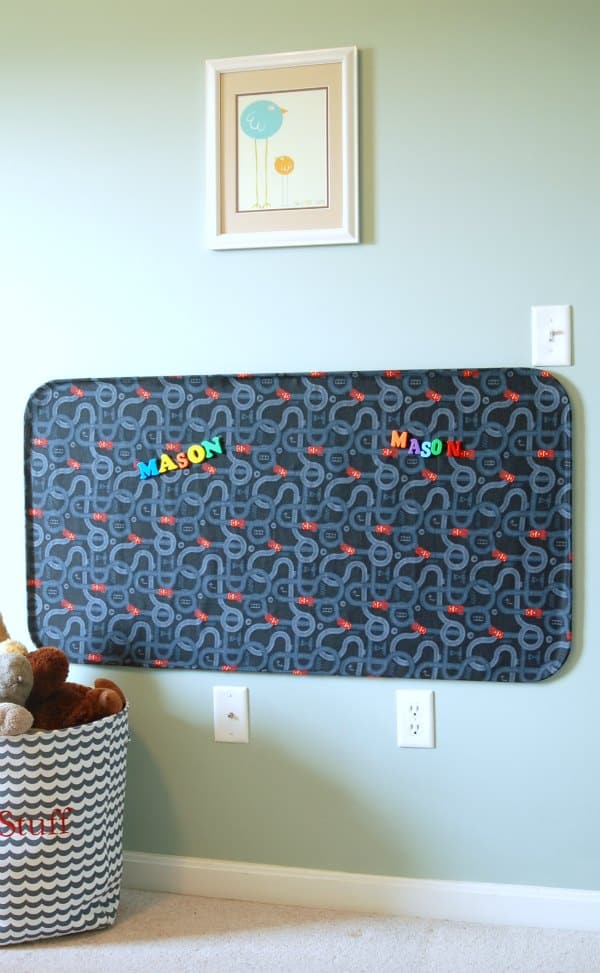 Using a magnet board to give each kid a creative space in a bedroom with letters and number magnets