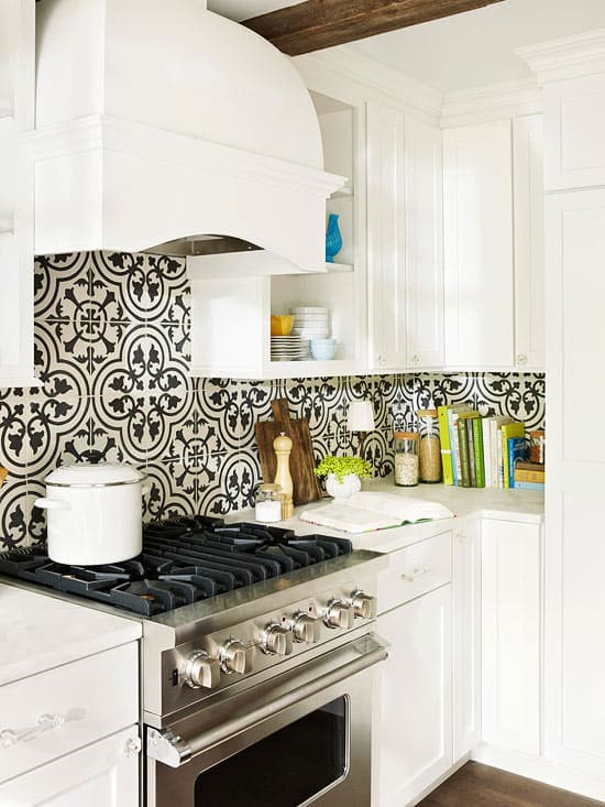 Black and white bold patterned cement tile backsplash is the perfect added character for this white kitchen featured by Better Homes and Gardens
