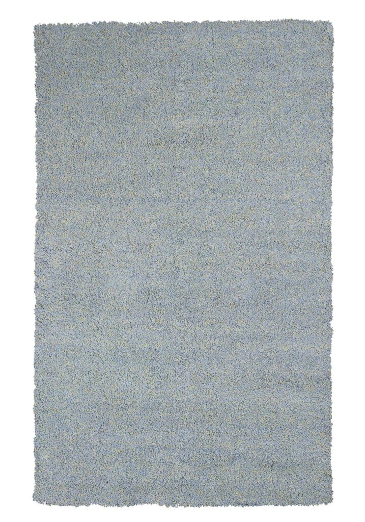 Blue shag rug to fill up space on the floor in a childrens bedroom and act as a play area