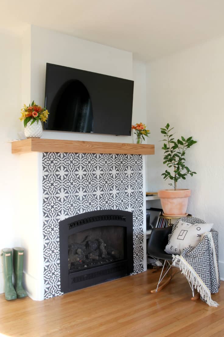 This fireplace built from The Grit and Polish incorporates black and white patterned cement tile and a beautiful oak mantel