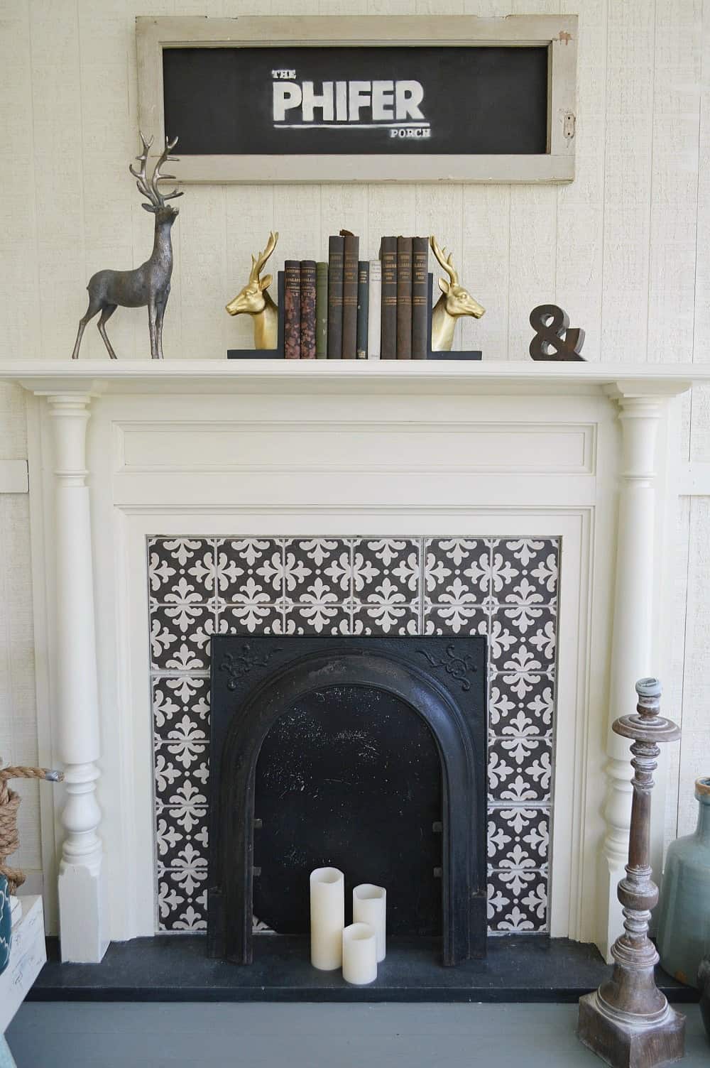 This outdoor fireplace with cement tile surround is actually faux in this screened-in porch makeover from Fox Hollow Cottage