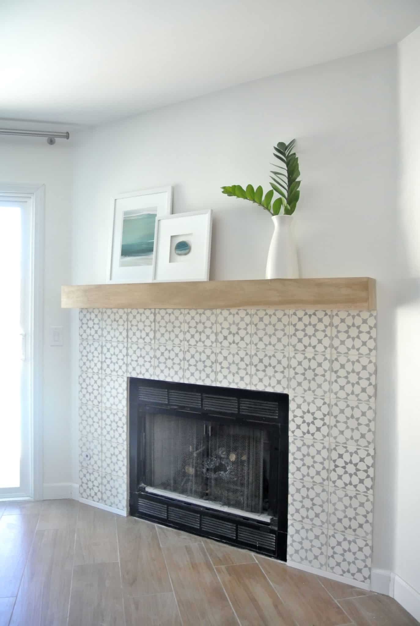 This corner fireplace makeover from Censtational Style is impressive, swapping out builder-grade tan tile for gorgeous grey and cream cement tile