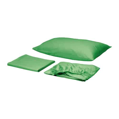 green bedding for a shared kids room with a pillow case, fitted sheet, and sheet for a childs bedroom
