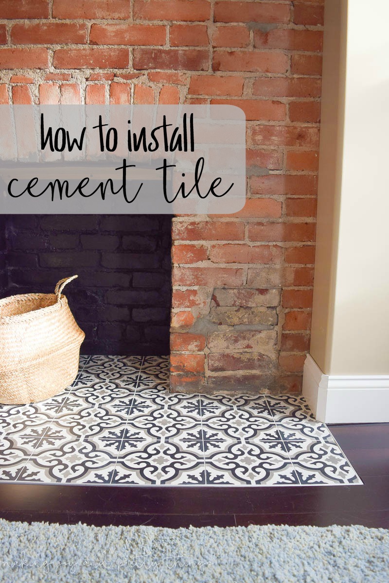 A natural brick fireplace with a tile hearth. Image text overlayed on the image reads "how to install cement tile"