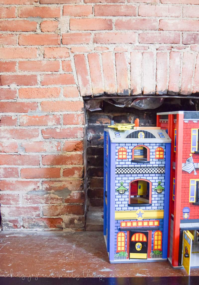 A closer look at the exposed brick fireplace before installing the cement tile hearth.