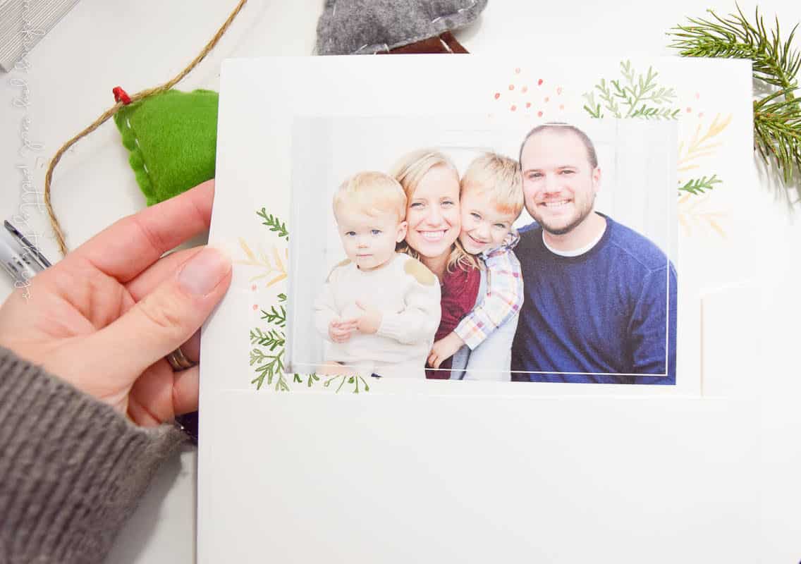 Picture of a family on custom farmhouse rustic style Christmas cards made by creating on minted.com