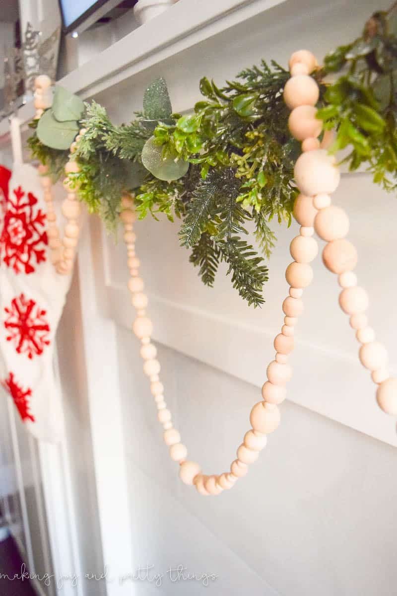 DIY wood bead garland combined with a floral string is a great farmhouse Christmas idea