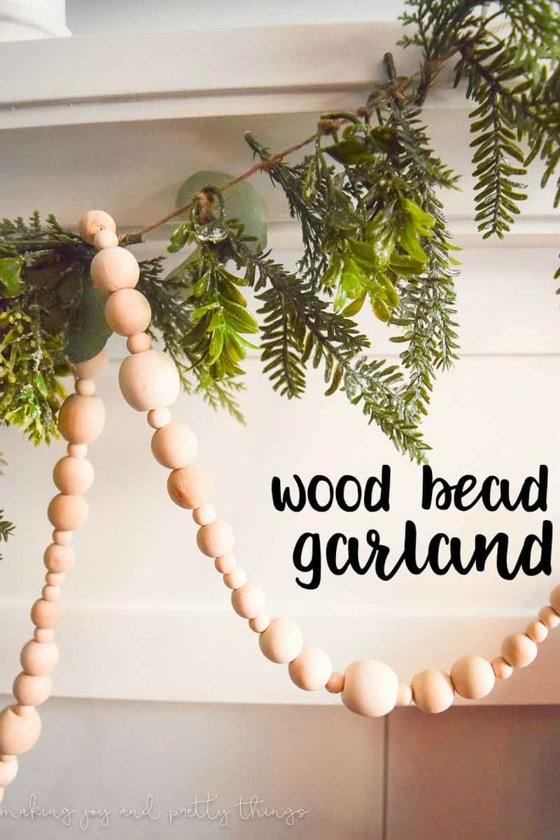 A DIY wood bead garland is a great way to spruce up the mantle in your living room to get ready for Christmas