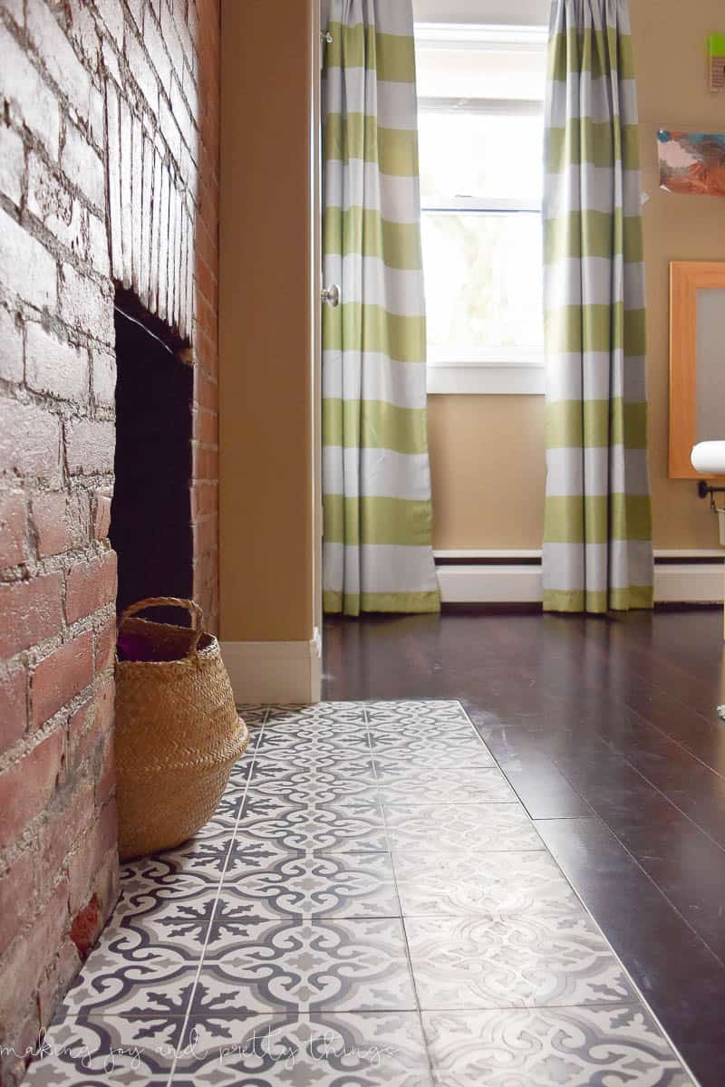 A Shared Boys Bedroom with a fun and playful design, including an adorable basket and curtain.