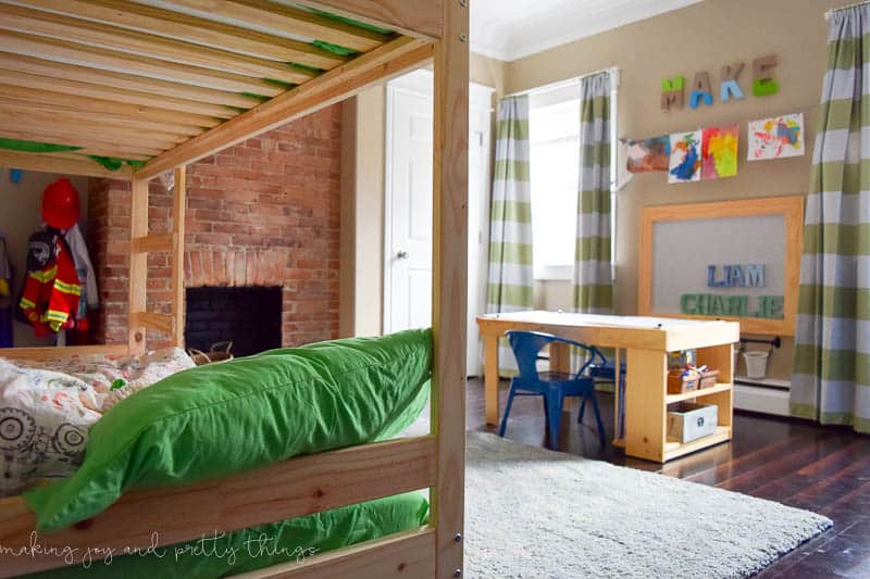 Shared Boys Bedroom storage and organization ideas, a kids craft table, kids' reading nook, bunk beds.