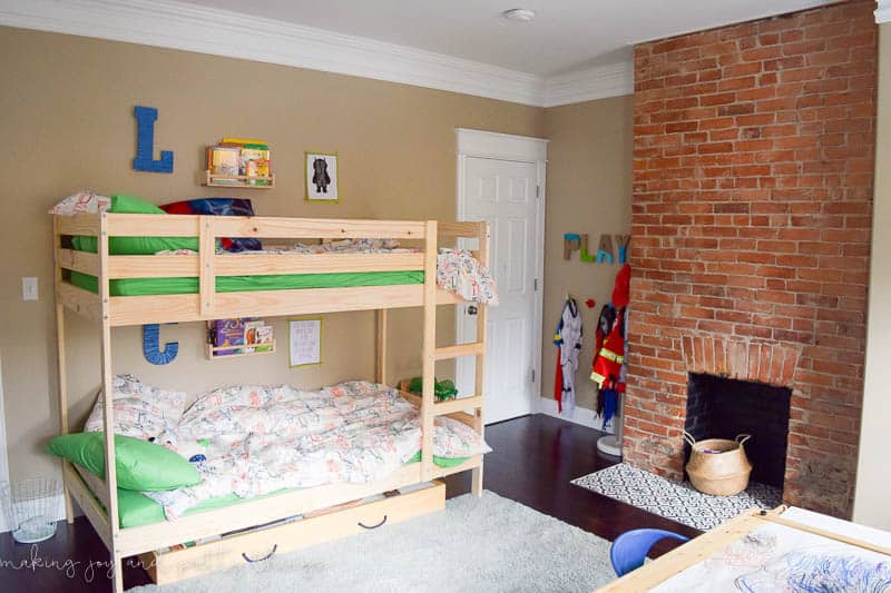 Shared Boys Bedroom packed with tons of storage and organization ideas, a kids craft table, kids reading nook, bunk beds, DIY magnet board, clothing storage and fun, bright and modern design!