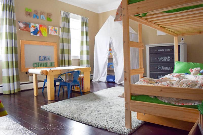 Shared Boys Bedroom packed with tons of storage and organization ideas, a kids craft table, kids reading nook, bunk beds, DIY magnet board, clothing storage and fun, bright and modern design!