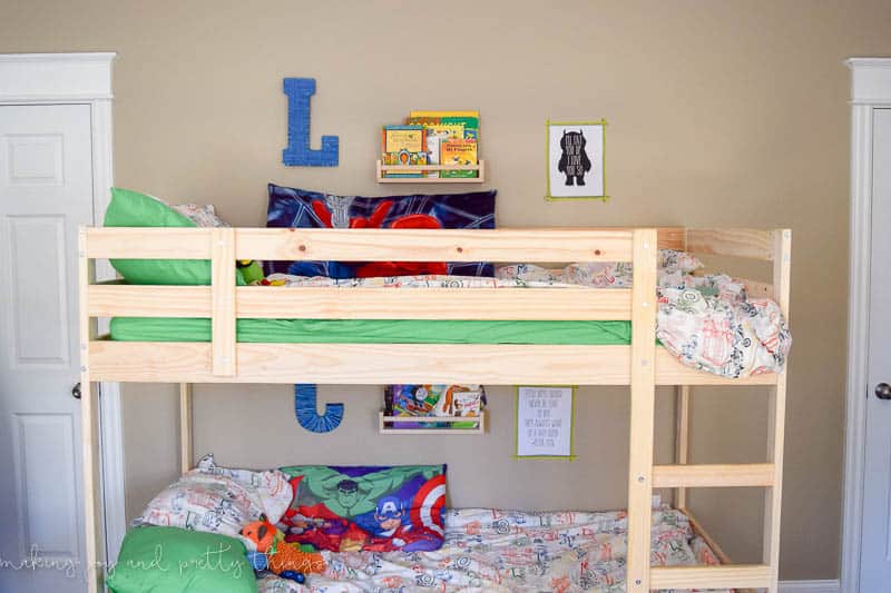 Shared Boys Bedroom packed with tons of storage and organization ideas, a kids craft table, kids reading nook, bunk beds, DIY magnet board, clothing storage and fun, bright and modern design!