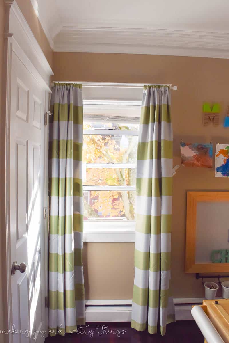A green stripe of curtain on the window