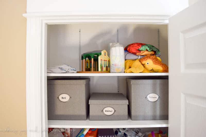 A photo of the third and fourth shelves, which are organized with bins.