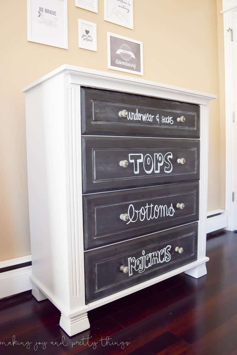 A chalkboard was painted on the cabinet, and a gallery wall hung above it.